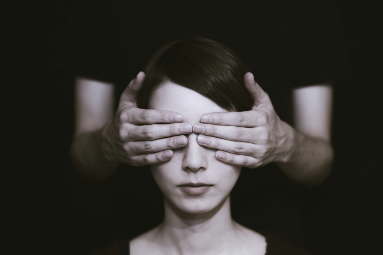 Hands covering a person's eyes, representing charities unaware of the DAF grants already looking for them